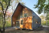Exterior of house showing all four quadrants and metal sleeve