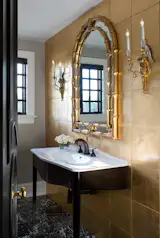 Main floor powder room glimmers with 24 karat gilded tile.