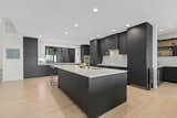 Kitchen, with Wilsonart Traceless laminate cabinets and reverse bevel on the countertops