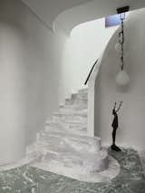 Curved marble staircase at entrance
