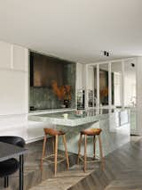 Kitchen, Stone Slab Backsplashe, Quartzite Counter, and Medium Hardwood Floor Kitchen  Photo 3 of 8 in This Marble-Clad Home in Sydney Shines Like a Gemstone by Smac Studio