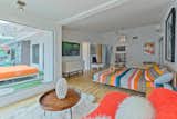 Large picture window and sliding doors to pool area and firepit. A "hippie" library and Woodstock artwork adds to the "Peace & Love" theme