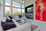 Marilyn Themed Media Room overlooks the front entry and courtyard and opens to the main living area