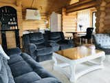 Built-in, dedicated coffee station; stainless steel and crystal chandeliers; coffee table refinished in white base with lacquered oak tabletop, solid oak dining table (blue chair was later replaced with a matching acacia bench)