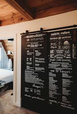 A mirrored closet door is repurposed as an information hub with local tips and cabin-stay instructions.