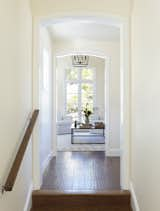 Flooring is white oak, hand scraped to a weathered and worn finish, prefinished off-site. It was made to match the salvaged wood floors in the main house. 