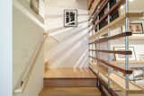 Staircase, Wood Tread, and Wood Railing A maple stairway offers display space for art and access to the 1,500 sq. ft. 34th floor. There you will fine additional living, dining, sleeping, and media space plus a kitchenette.  Photo 9 of 17 in Minimalist Penthouse Highest Residence in Michigan $1.3M by Jamie Starner