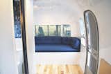 The oversized bench was built into the Airstream curvature to amplify every available inch of real estate.