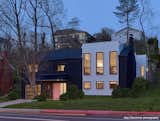 Exterior, Wood Siding Material, Shingles Roof Material, Hipped RoofLine, and House Building Type New house front at dusk   Photo 1 of 34 in THE BLACK AND WHITE HOUSE WITH A TOUCH OF PINK by PLDESIGNSTUDIO & STUDIO D ARCHITECTURE LUGLI