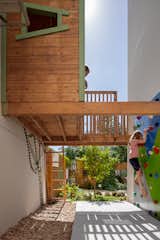 What started out as an awkward gap between the house and the adjacent duo, became the kid's favorite part of the house. " we decided not to ignore it as the previous owners did. We actually paid attention to it and turned this neglected space into the most magical part of the yard", explains Chen.