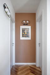 The walls feature art from the owner's professional world - copies of manuscripts, murals and unique maps. The lighting in the house is inspired by the style of lighting that exists on the Temple Mount.