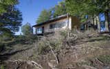 Exterior, Flat RoofLine, Wood Siding Material, Metal Roof Material, Cabin Building Type, and Glass Siding Material  Photo 6 of 34 in Pollux Refuge by Ruben Rivera Peede