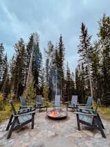Outdoor firepit patio with Canadian muskoka chairs.