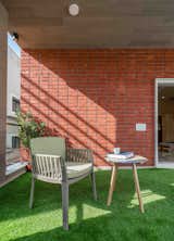 Outdoor and Garden The attached terrace garden that elevates in the south-east facade gives the users a chance to get closer to the outside world.  Photo 12 of 27 in THE SHADED HOUSE |  PRASHANT PARMAR ARCHITECT by Prashant Parmar Architect - Shayona Consultant