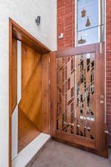 The door is adorned with brass detailing and veneer finish that makes a great first impression. 