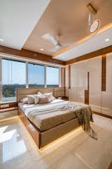 The Master bedroom is created with a unique design where the toilet door was extruded to be a part of the wardrobe, creating an interesting hidden element within the space. Seamless, but the deep margins between segments add a sense of refinement to this wardrobe wall. A lovely approach in a minimalistic bedroom, where you don’t want to draw undue attention to the cabinetry and toilet door.