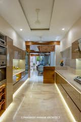 Kitchen: It has visual connectivity to the drawing room & the front road to have a good visual control over outside activities & the entry as well while cooking.