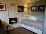 After photo of the completed cabana. We added a small electric fireplace for heat and a wall air conditioner for cooling. We used masonite wall board to cover a host of evils.