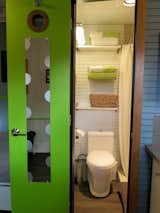 Bath Room, Ceiling Lighting, Open Shower, Vinyl Floor, Ceramic Tile Wall, and One Piece Toilet The tiny bathroom with shower  Photo 3 of 15 in 15 Tiny Bathroom Ideas For a Beautiful and Functional Space from La Cabana