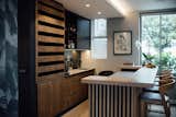 Living Room, Recessed Lighting, Chair, Light Hardwood Floor, Ceiling Lighting, and Accent Lighting Bar Interiors & Detail  Photo 3 of 7 in Compact Townhouse Living by Jenny Mills Architecture & Interiors