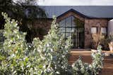 Exterior, Metal Roof Material, Farmhouse Building Type, Gable RoofLine, and Stone Siding Material Lodge entrance  Photo 1 of 38 in Cederberg Ridge - Wilderness Lodge by Jenny Mills Architecture & Interiors