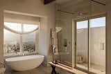 Bath Room, Open Shower, Freestanding Tub, Concrete Wall, Ceiling Lighting, and Porcelain Tile Floor Bathroom  Photo 7 of 38 in Cederberg Ridge - Wilderness Lodge by Jenny Mills Architecture & Interiors