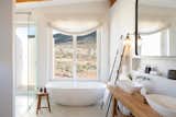 Bath Room, Freestanding Tub, Porcelain Tile Floor, Ceiling Lighting, Open Shower, Vessel Sink, Wood Counter, and Concrete Wall Bathroom  Photo 9 of 38 in Cederberg Ridge - Wilderness Lodge by Jenny Mills Architecture & Interiors