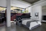Bedroom, Bed, Rug Floor, Ceiling Lighting, Accent Lighting, Chair, Bench, Recessed Lighting, Concrete Floor, and Wardrobe Main Bedroom Suite  Photo 13 of 14 in Fresnaye Pool Penthouse by Jenny Mills Architecture & Interiors