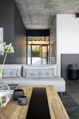 Living Room, Ceiling Lighting, Recessed Lighting, Concrete Floor, Coffee Tables, Rug Floor, and Sofa Living Area toward Entrance  Photo 3 of 14 in Fresnaye Pool Penthouse by Jenny Mills Architecture & Interiors