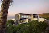 Exterior, Concrete Siding Material, House Building Type, Beach House Building Type, Glass Siding Material, Metal Siding Material, and Flat RoofLine External view of Entrance  Photo 4 of 14 in Fresnaye Pool Penthouse by Jenny Mills Architecture & Interiors