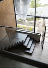 Staircase, Glass Railing, Wood Tread, and Metal Railing Staircase  Photo 13 of 32 in Welgedacht Villa by Jenny Mills Architecture & Interiors