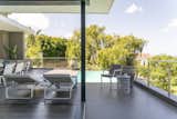 Outdoor, Metal Fences, Wall, Large Patio, Porch, Deck, Trees, Small Pools, Tubs, Shower, Back Yard, Shrubs, and Flowers Outdoor Terrace and Pool  Photo 9 of 32 in Welgedacht Villa by Jenny Mills Architecture & Interiors
