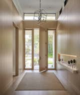 The interior palette incorporates natural elements in a minimalist design. 