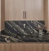 The interior palette incorporates natural elements in a minimalist design. 