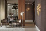 The area is also accented with a bronze-and-gold-finish Charles Paris wall lamp 