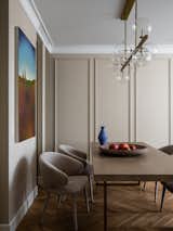 "I like the living room for its lightness. The dining group looks a bit ascetic, I like this effect.", says Olga Lagodnaya, designer. 
Blue vase Julia Kaptur, Little Greene paint.