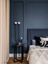The gypsum panel was made according to the designer's sketches and supplemented with Pholc wall lamps.
