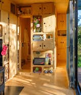 Bath Room, Ceiling Lighting, Light Hardwood Floor, One Piece Toilet, Wood Counter, and Open Shower  Photo 8 of 35 in Container House Gaia by PinUp Houses