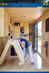 Bedroom, Light Hardwood Floor, Bed, and Storage  Photo 11 of 35 in Container House Gaia by PinUp Houses