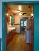Before: west view of kitchen towards dining room