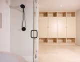 Master bath is open to the bedroom, with tiled and plywood finishes flush with one another