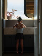 Vanity window with reverse mirror