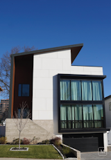 This project showcases a contemporary home in Cliffside, NJ. Stucco with scribed lines give a sense of scale and create rhythm in the architecture. Contrasting materials like the black aluminum frames, crisp white stucco, and warm wood on the underside of the soffit all blend well together to create modern lines on the exterior of this home. 
