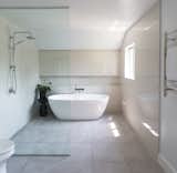 Neutrals brighten this freestanding tub and shower combo
