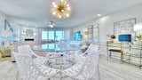 Dining Room, Light Hardwood Floor, Ceiling Lighting, Table, Desk, and Chair Enjoy your meal together while overlooking the beach.  Photo 3 of 28 in Pipers Run 2 by Jeff Paglialonga