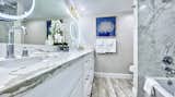 Bright and white decor extended to the bathrooms