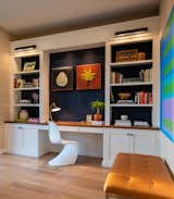 Living Room, Light Hardwood Floor, Chair, Bench, Accent Lighting, Ottomans, Bookcase, and Wall Lighting The new custom built in. The drawers have  charging stations and a pull out printer.  Photo 5 of 10 in A Loft with Charm by Sara Coax