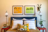 Guest Bedroom with the client's artwork and a Moroccan sea grass animal head.