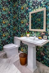 Powder room with animal themed wallpaper