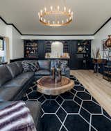 Coffee Tables, Sectional, Light Hardwood Floor, and Ceiling Lighting Bonus Room  Photo 11 of 17 in Modern Farmhouse by Graig Cady Design